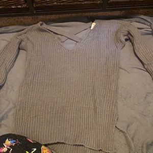 Gray sweater crossed in back